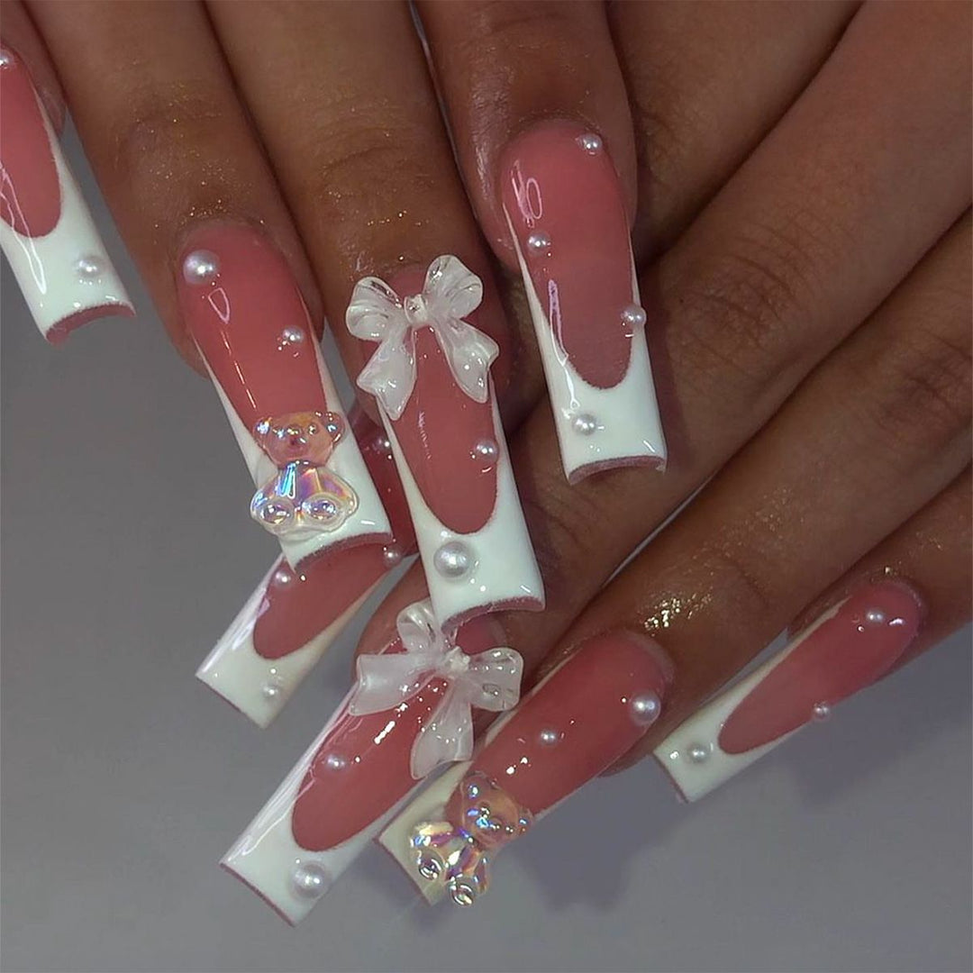 Elegant artificial nails with delicate bows and pearls Stornfield