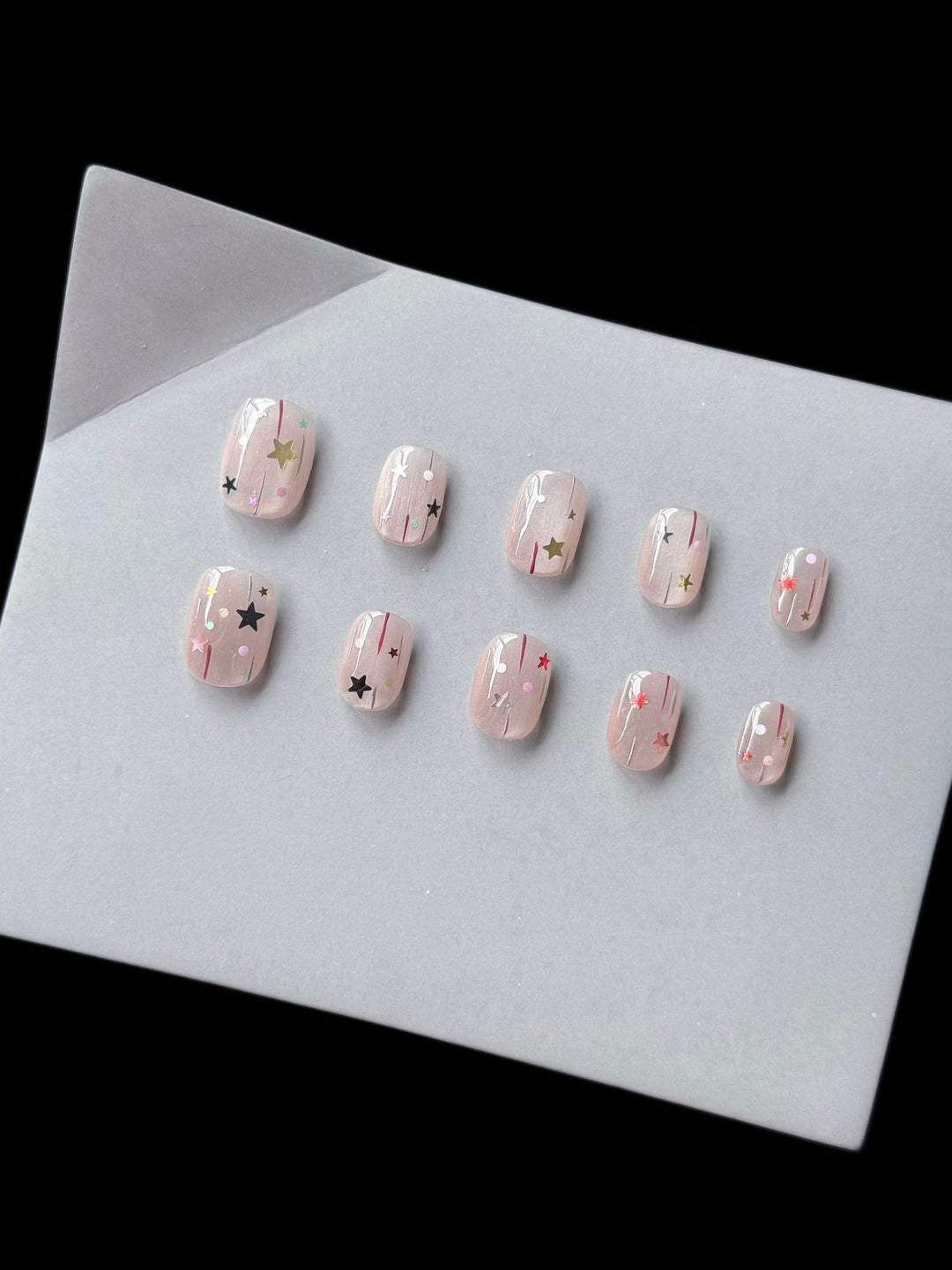 Artistic Press-On Nail Art Set Featuring Star and Glitter Designs