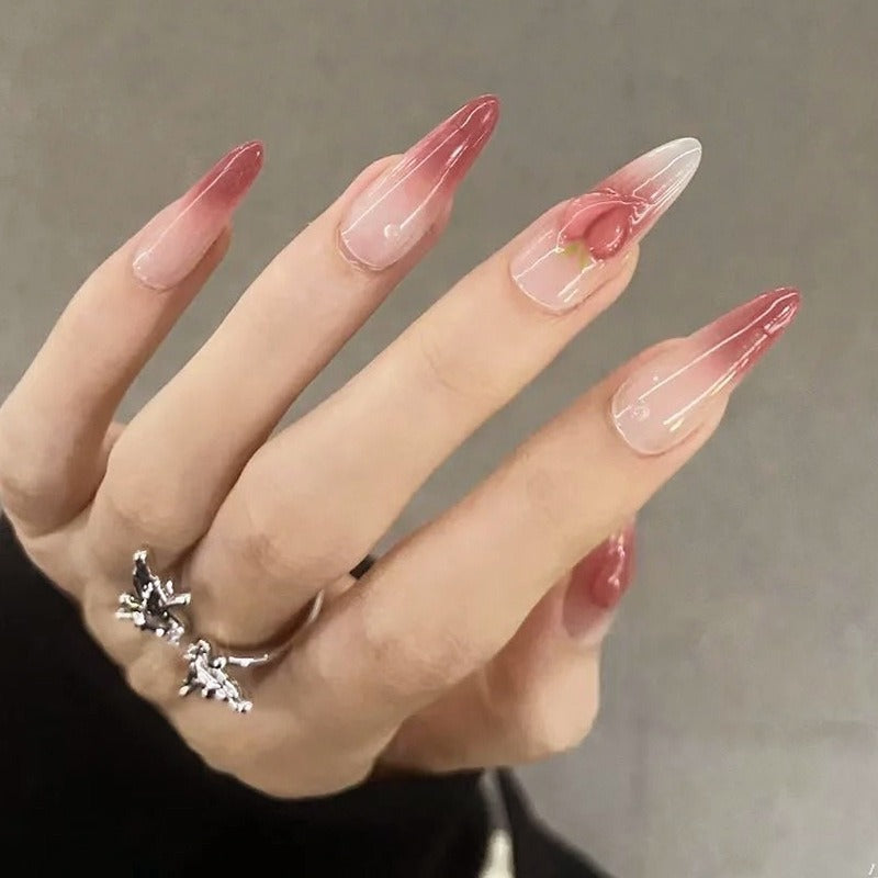 Nail set in elegant ombre design with artistic accents Stornfield