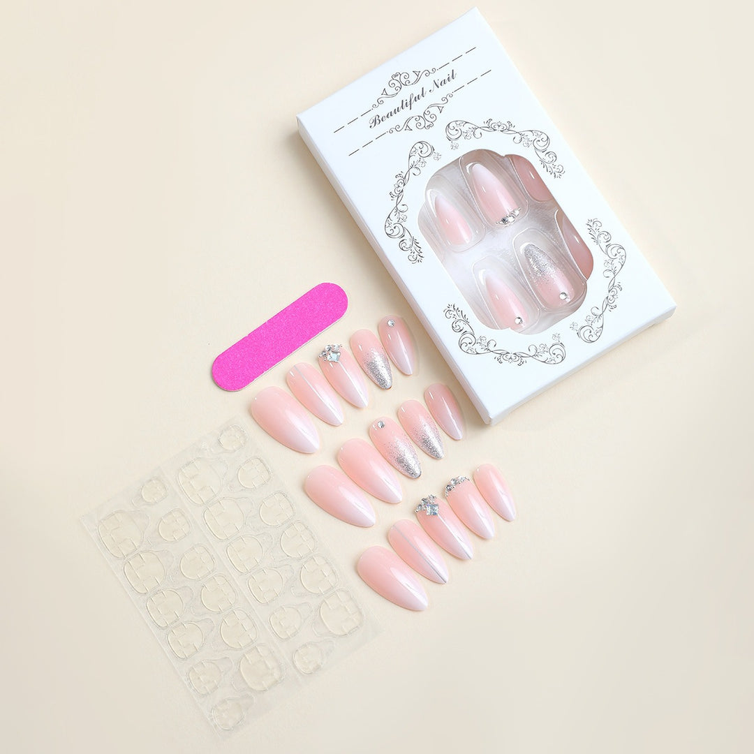 Artificial nail set with elegant glitter and rhinestone accents Stornfield