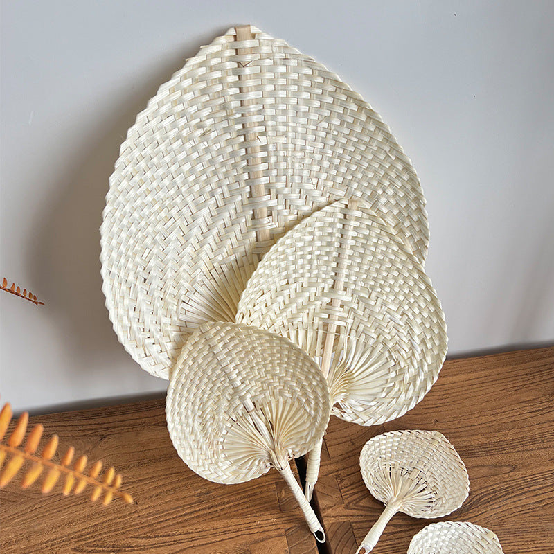 Women hand-woven fan made of natural material Stornfield