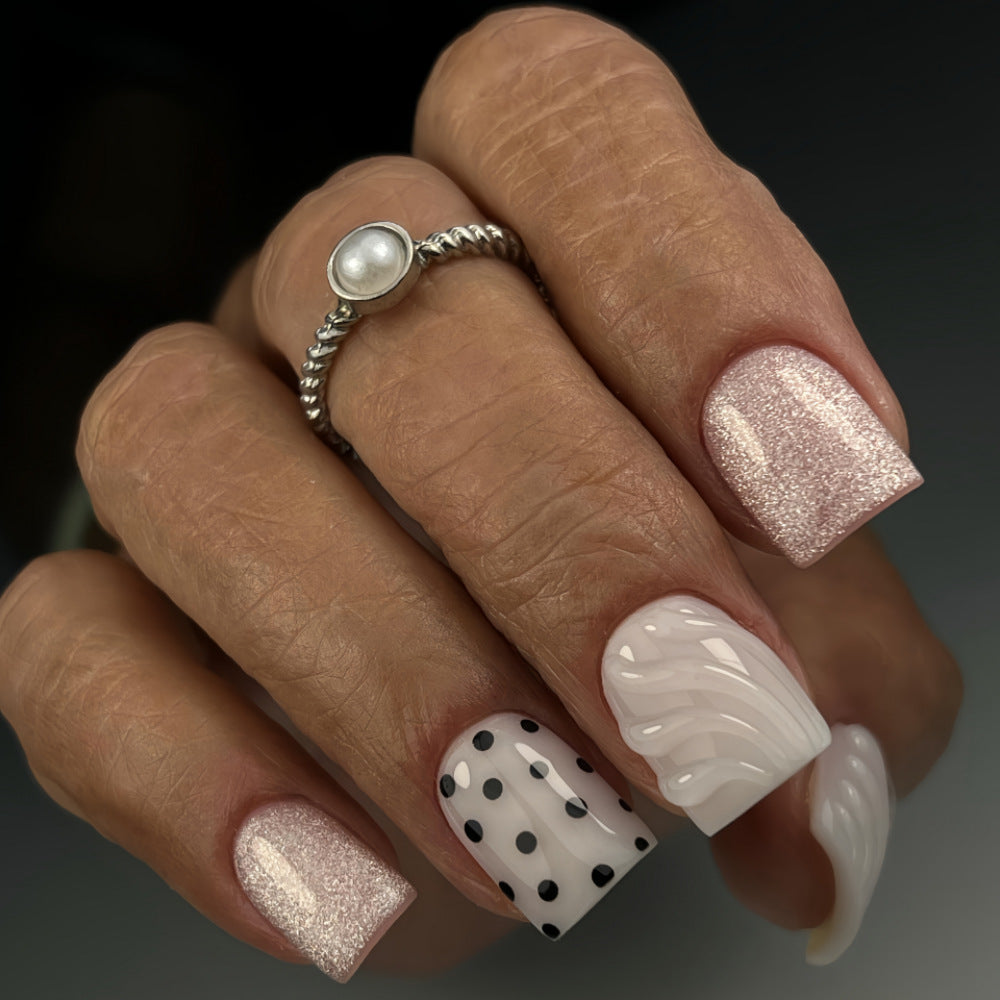 Artificial nails with diverse patterns and glitter effects Stornfield