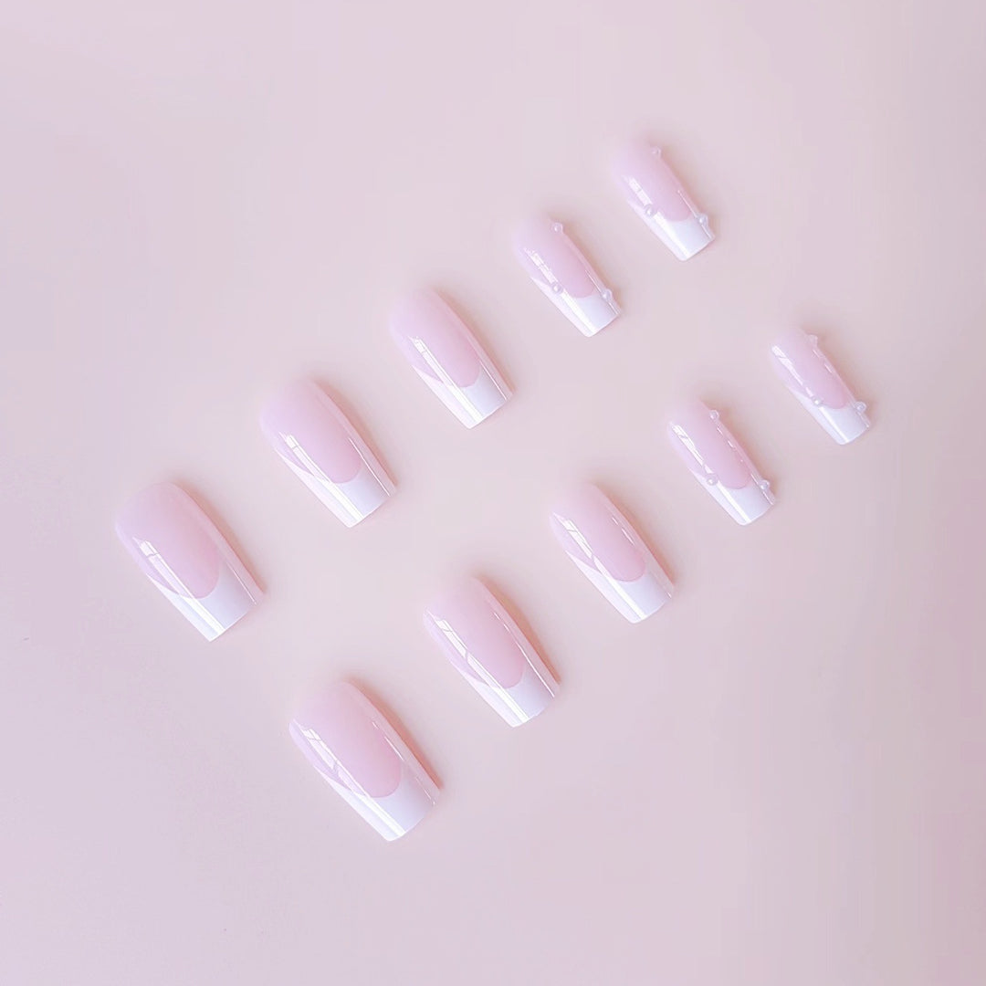 Artificial nail tips with elegant pearl accents Stornfield