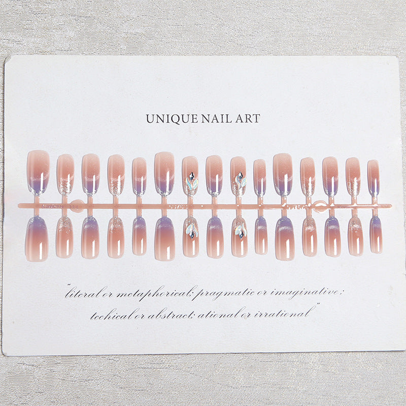 Acrylic nail set with elegant glitter effect and beautified embellishments Stornfield