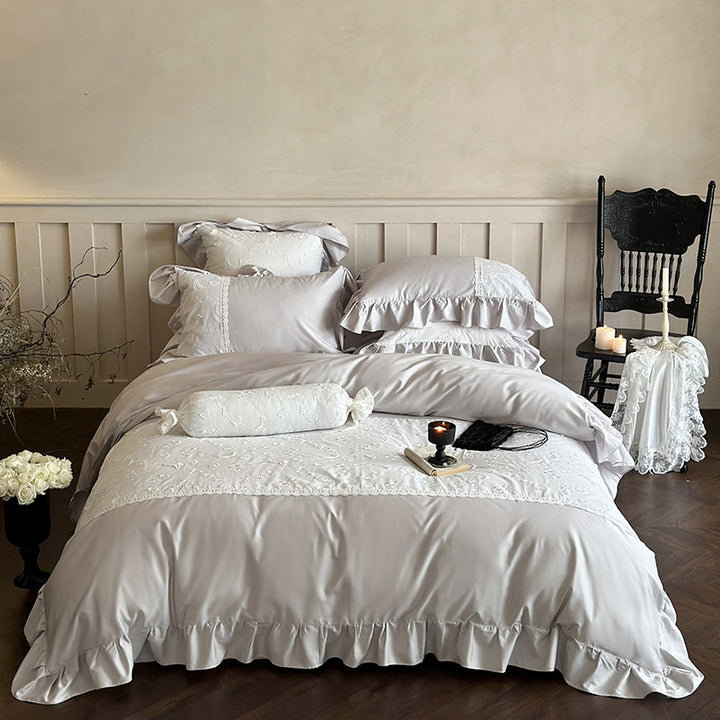 Luxurious satin bedding set with ruffles, lace trim, and fine embroidery