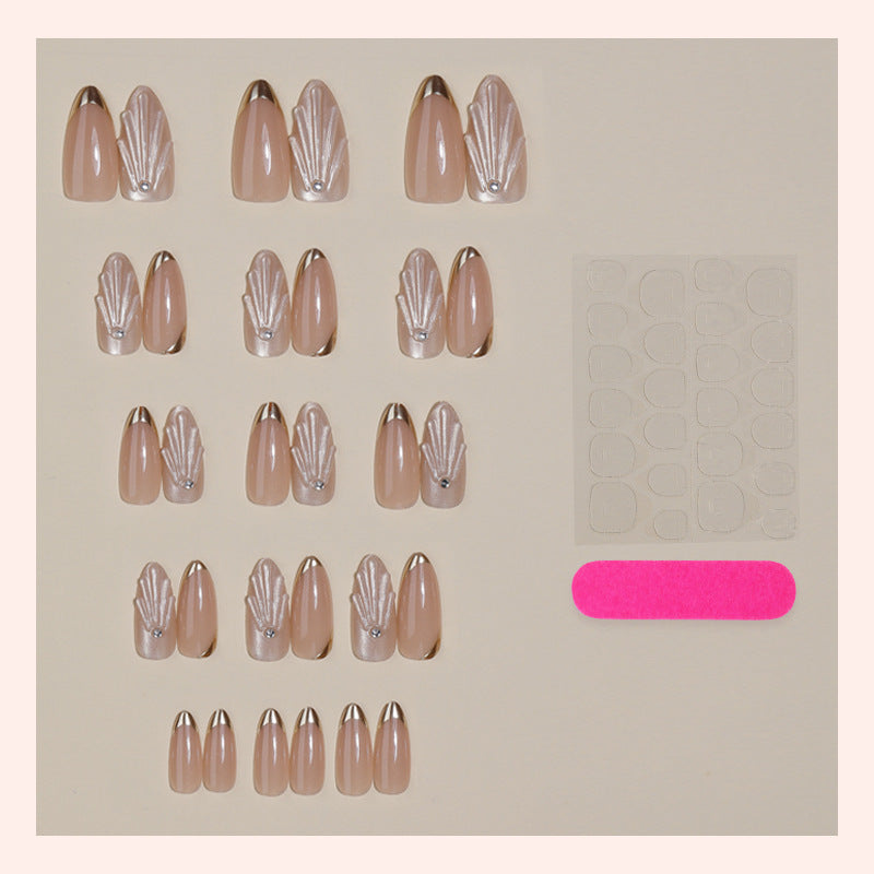 Artificial nail set with elegant gold tips and artistic decorations Stornfield