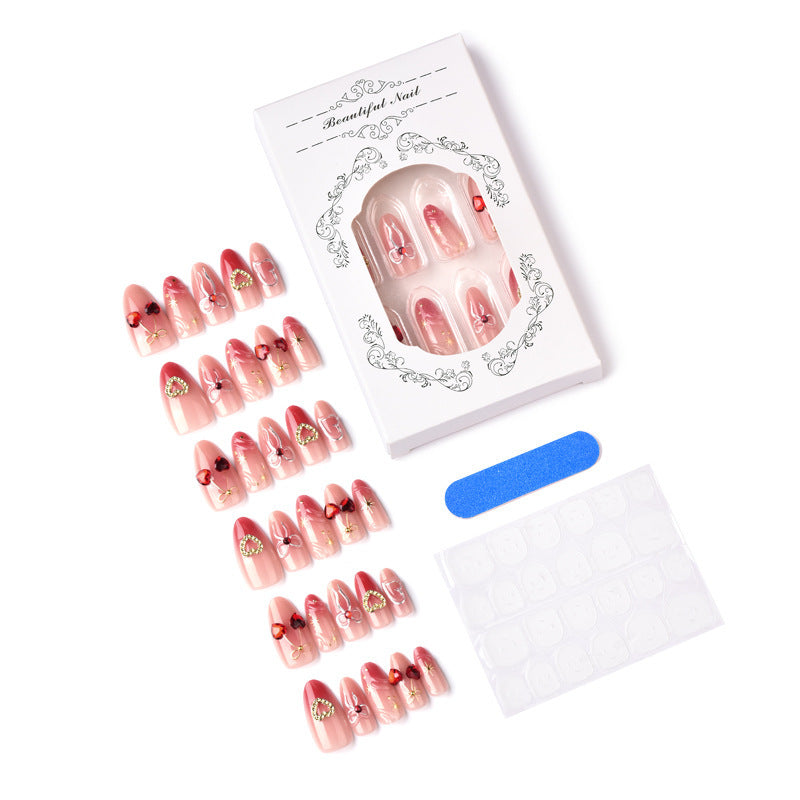 Decorative artificial nails with romantic heart and bow motifs Stornfield