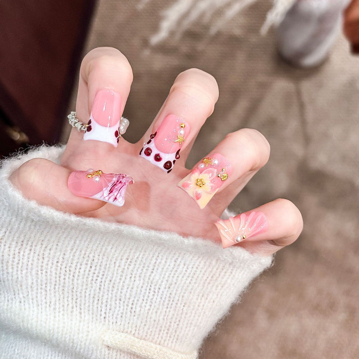 Artistic Acrylic Nail Design with Gem Accents