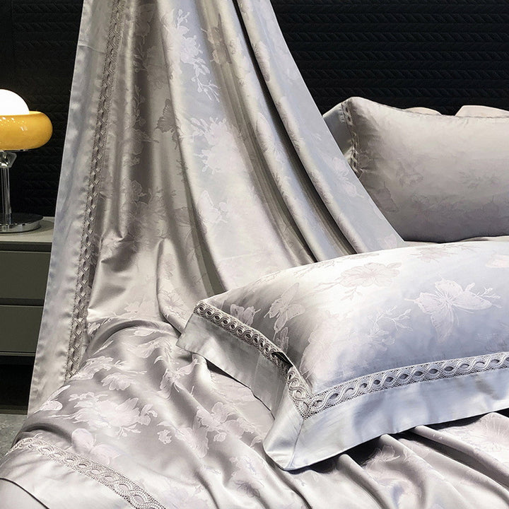 Premium cotton satin bedding set with fine jacquard floral texture and piped border