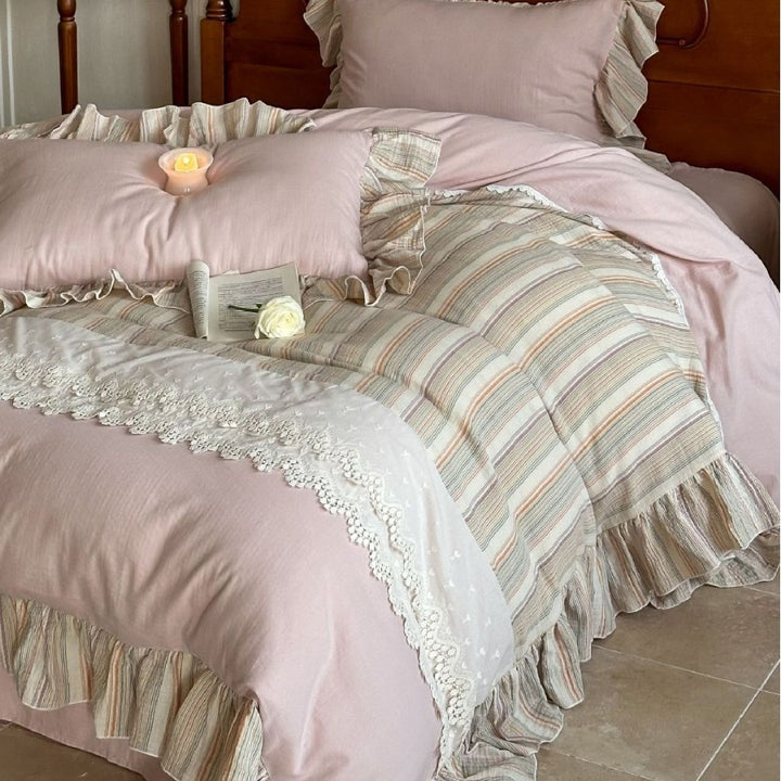 Multi-piece cotton satin bedding set with lace trim and striped ruffled bed skirt