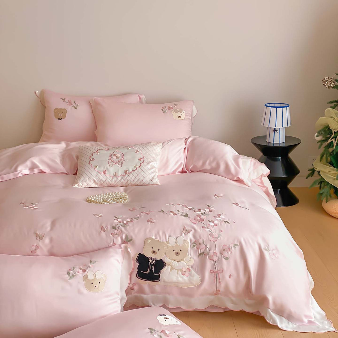 Satin bedding set with embroidered wedding bears, ruffled hem & decorative pillows