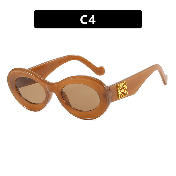Women's fashionable sunglasses with oval frame and golden accents Stornfield