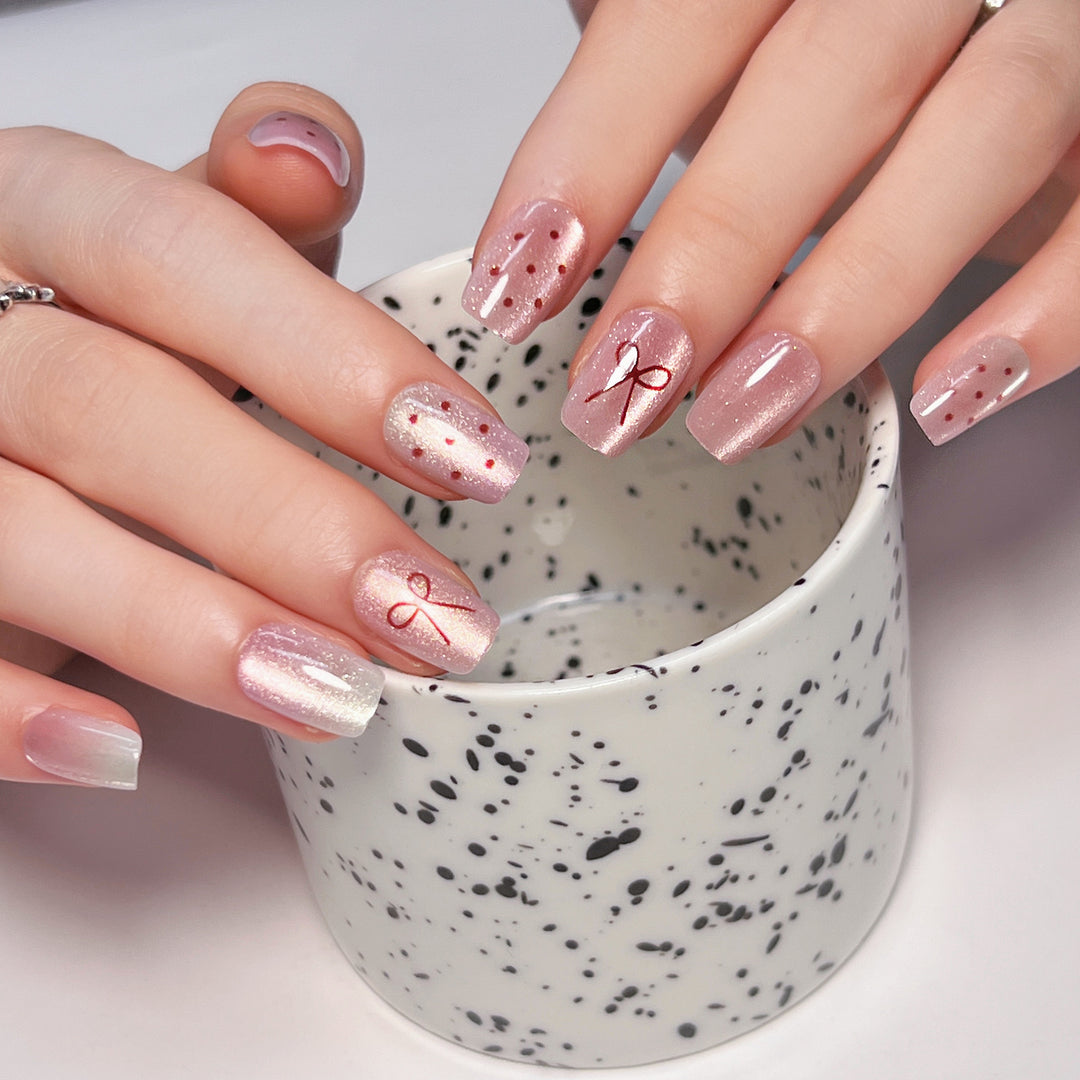 Artificial nail art with cute bow design Stornfield
