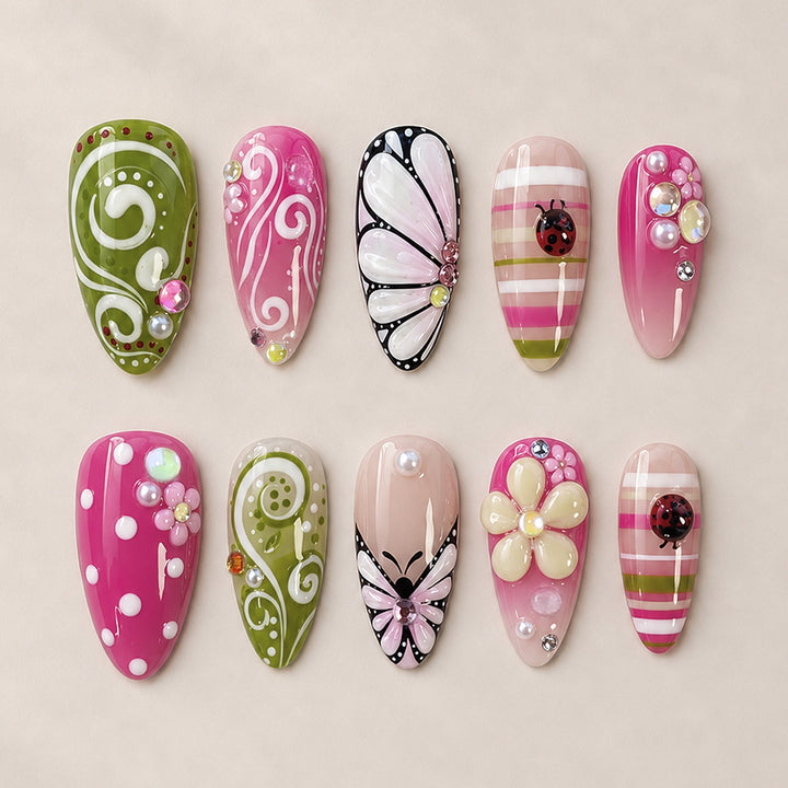 Artificial nail set with playful floral and glitter motifs Stornfield