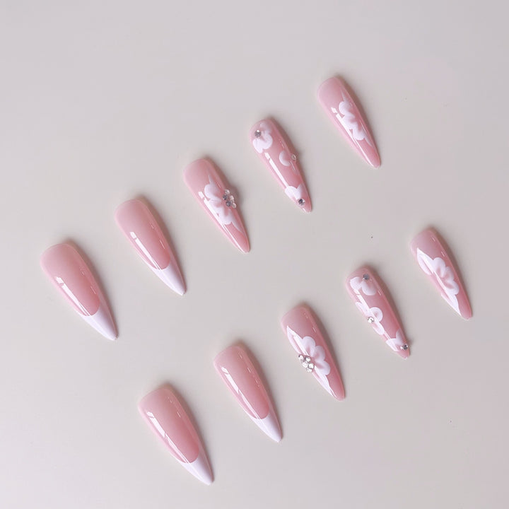 Elegant artificial nail set with floral design and glitter accents Stornfield