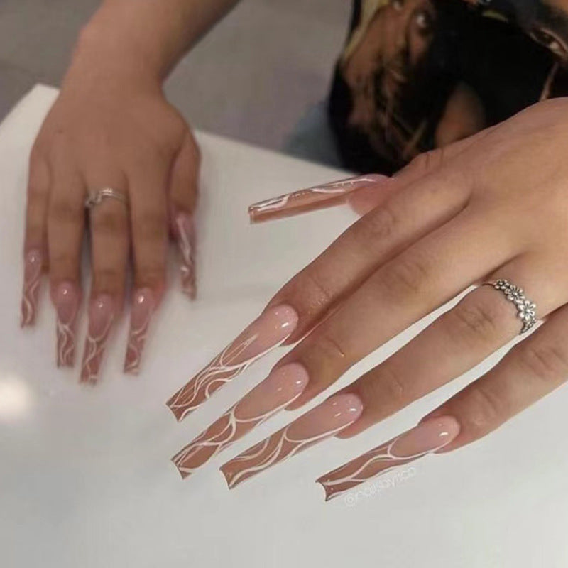 Stylish artificial nails with elegant patterns Stornfield