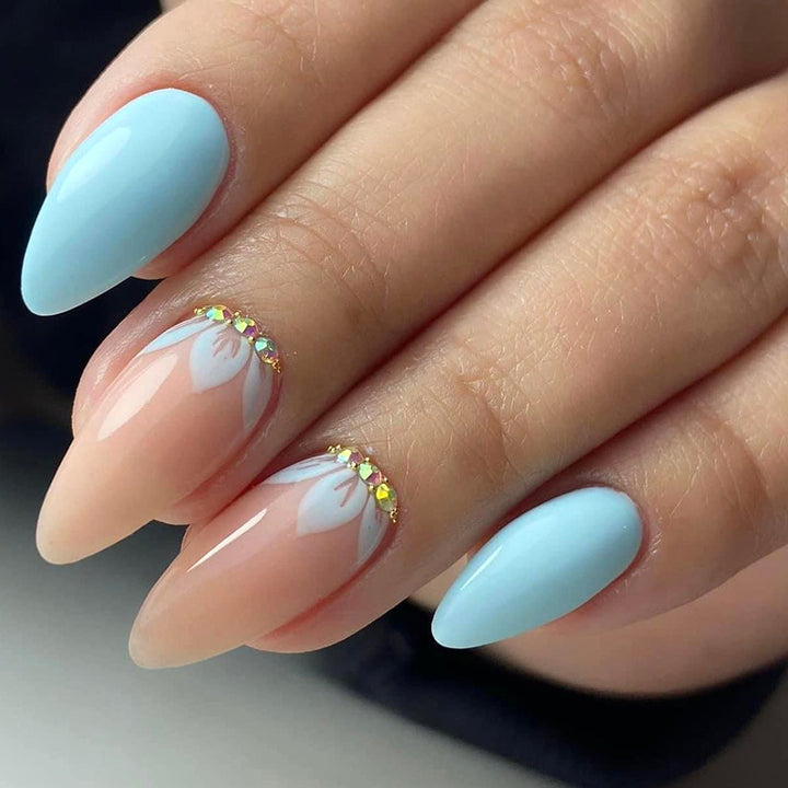 Artificial nails with elegant leaf patterns and rhinestone embellishments Stornfield