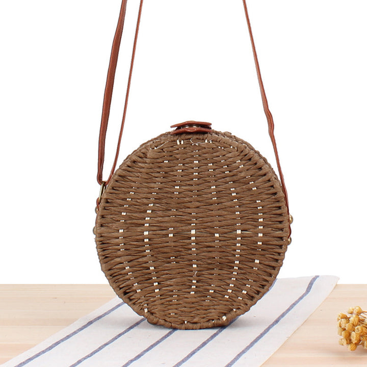 Round basket bag with leather accents Stornfield