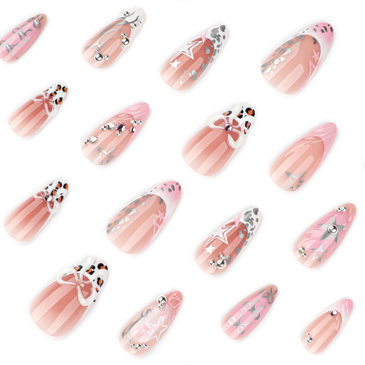 Artful stiletto nails with glitter and bow decorations Stornfield