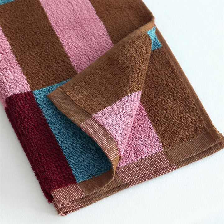 Soft terry hand and bath towel set made of cotton with geometric check pattern