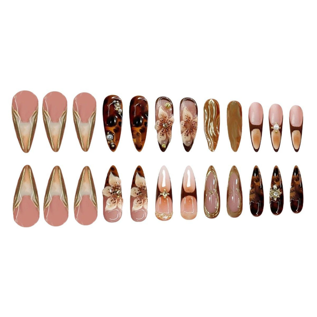 Artistic Stiletto Press-On Nail Art with Floral and Gemstone Accents Stornfield