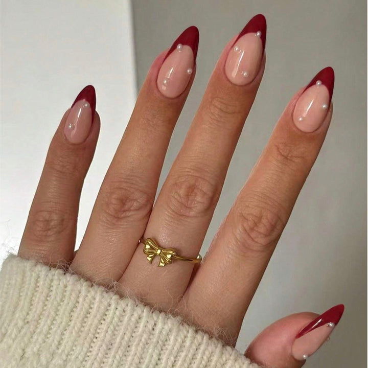 Acrylic nail set with elegant spike design and shimmering accents Stornfield