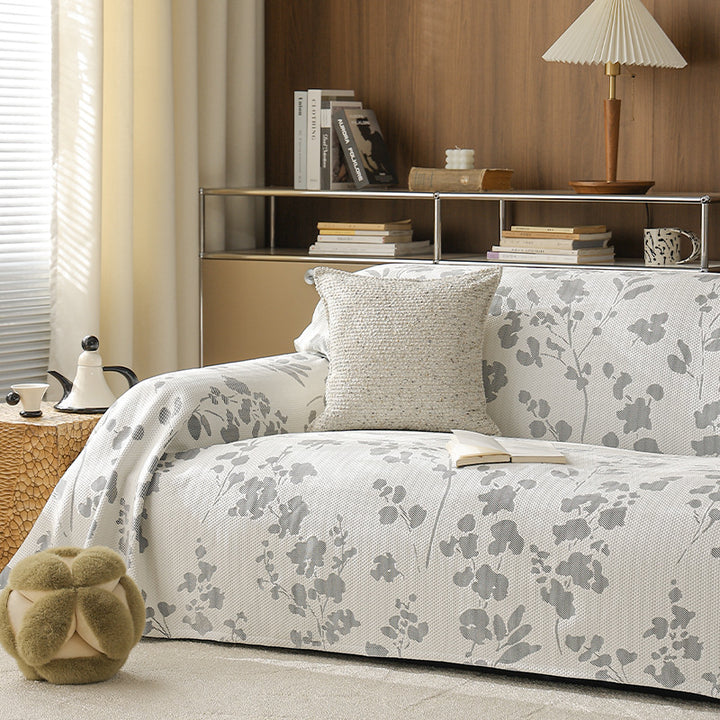 Elastic sofa cover with floral relief structure and universal fit