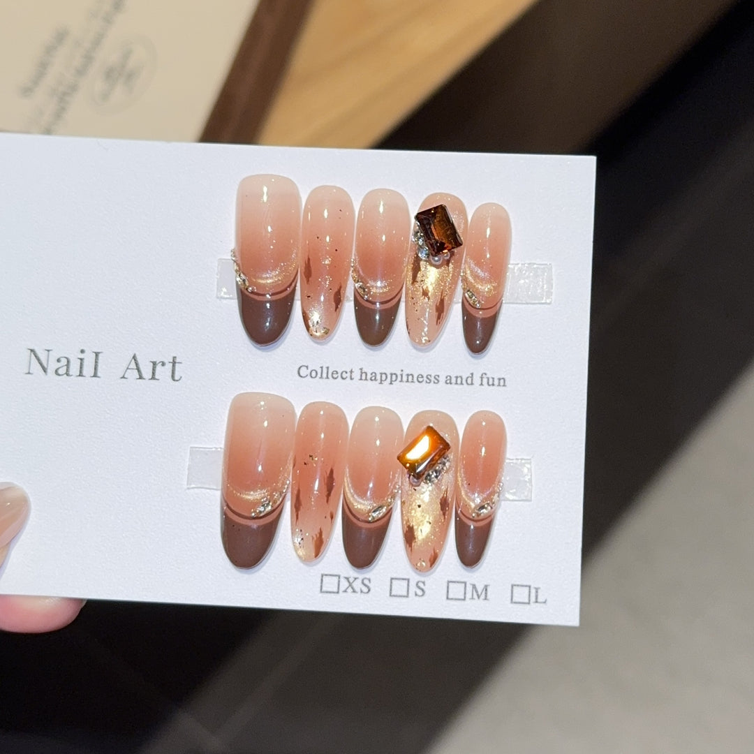 Artificial nails with elegant glitter and gold accent design Stornfield