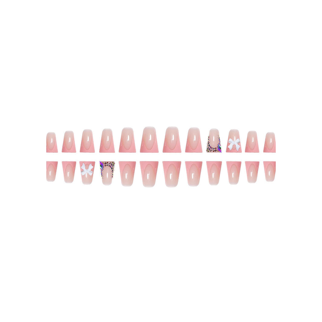 Decorative Acrylic Nail Enhancements with Bow and Rhinestone Accents Stornfield