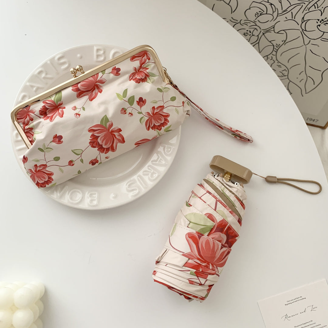 Ladies elegant folding umbrella with floral design and practical case Stornfield