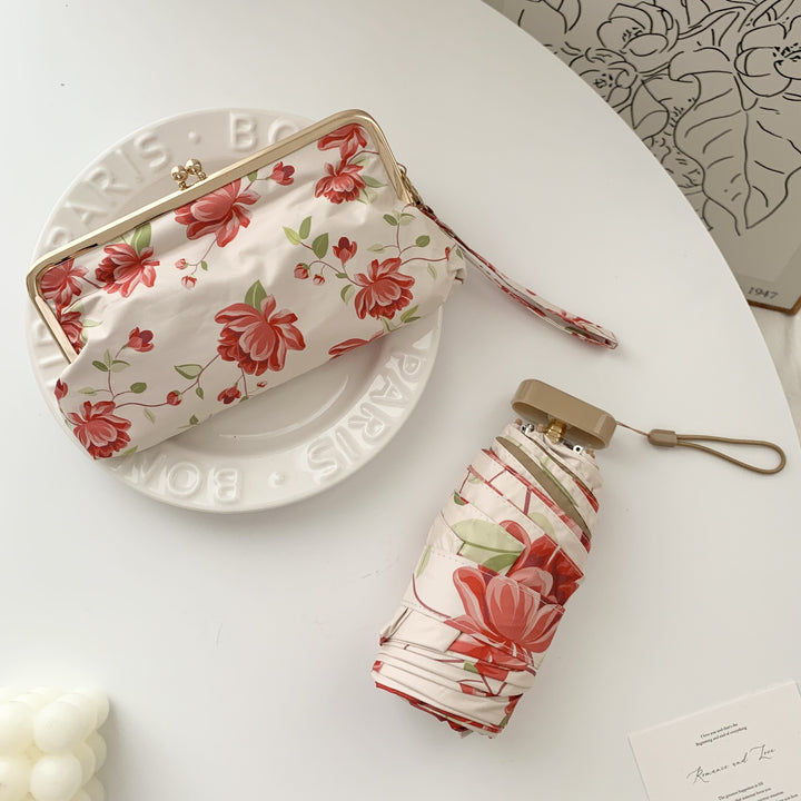 Ladies elegant folding umbrella with floral design and practical case Stornfield