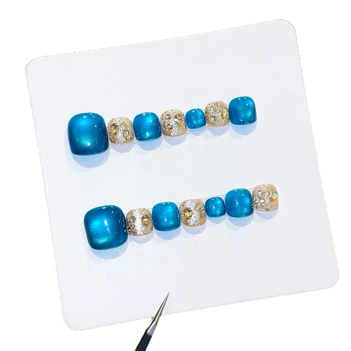 Art Nail Design with Shimmering Accents and Sparkling Rhinestone Details Stornfield
