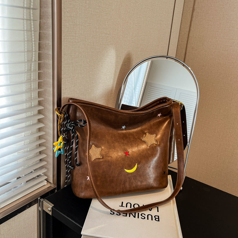 Shoulder bag with charming applications Stornfield