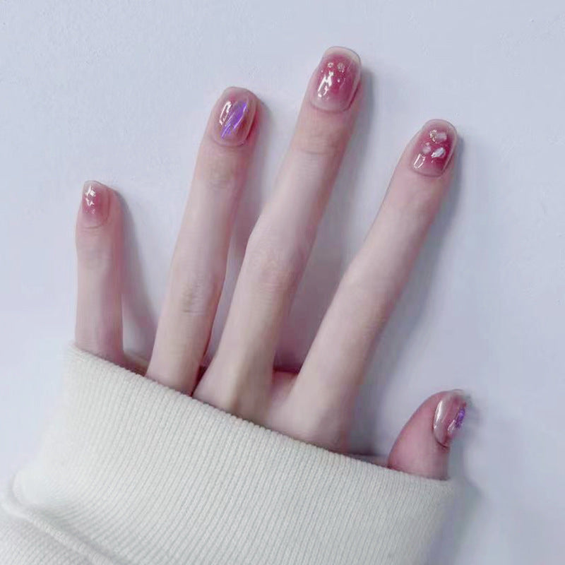 Artificial nails with delicate glitter design and floral accent Stornfield