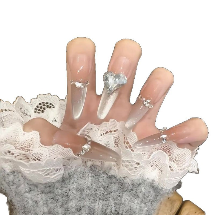 Acrylic nail set with elegant tips and glamorous rhinestone accents Stornfield
