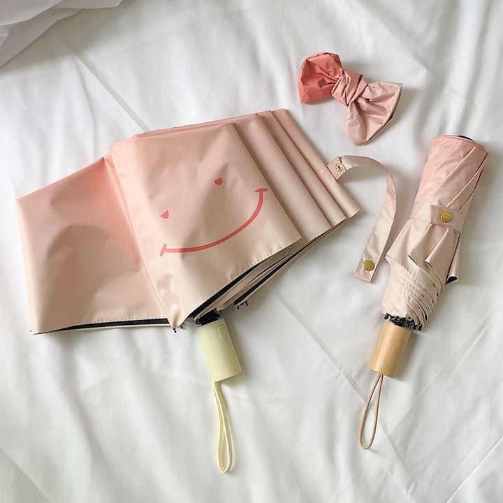 Women's foldable umbrella with playful design and handy wooden handle Stornfield