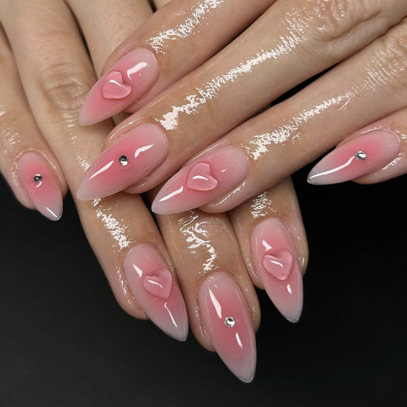 Artful stiletto nails with heart design and glitter accents Stornfield