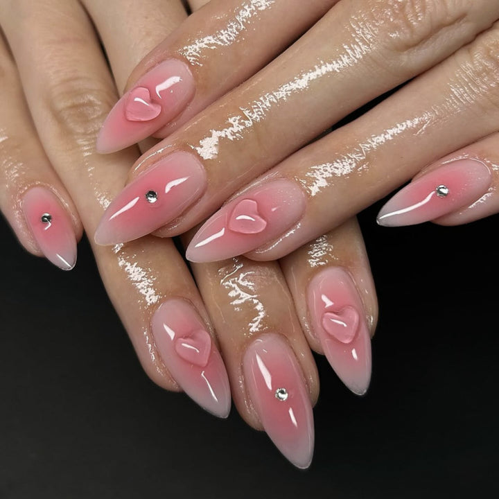 Artful stiletto nails with heart design and glitter accents Stornfield