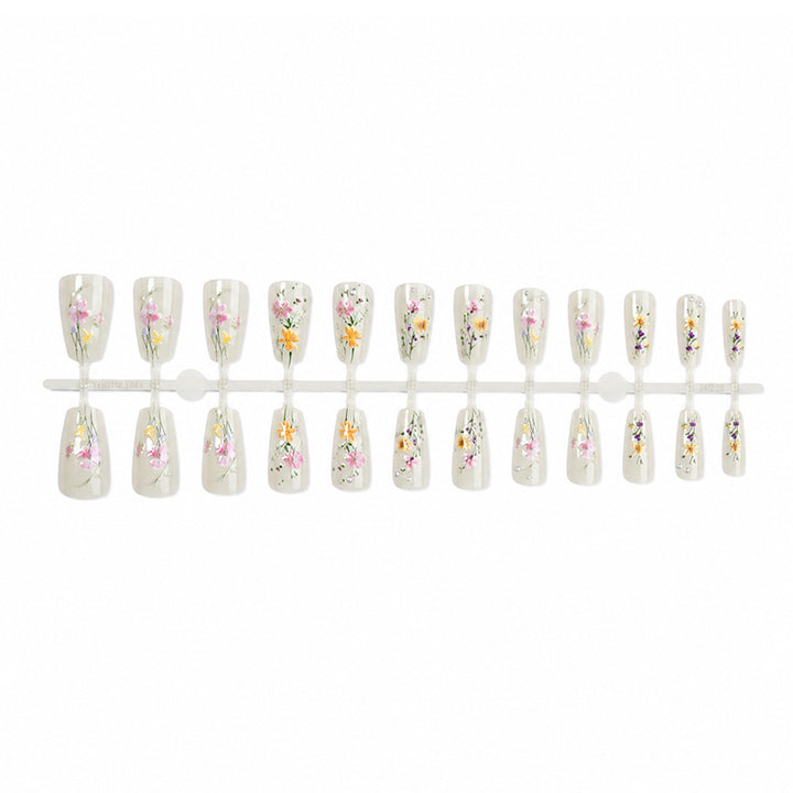 Artificial nail set with floral embellishments and glamorous details Stornfield