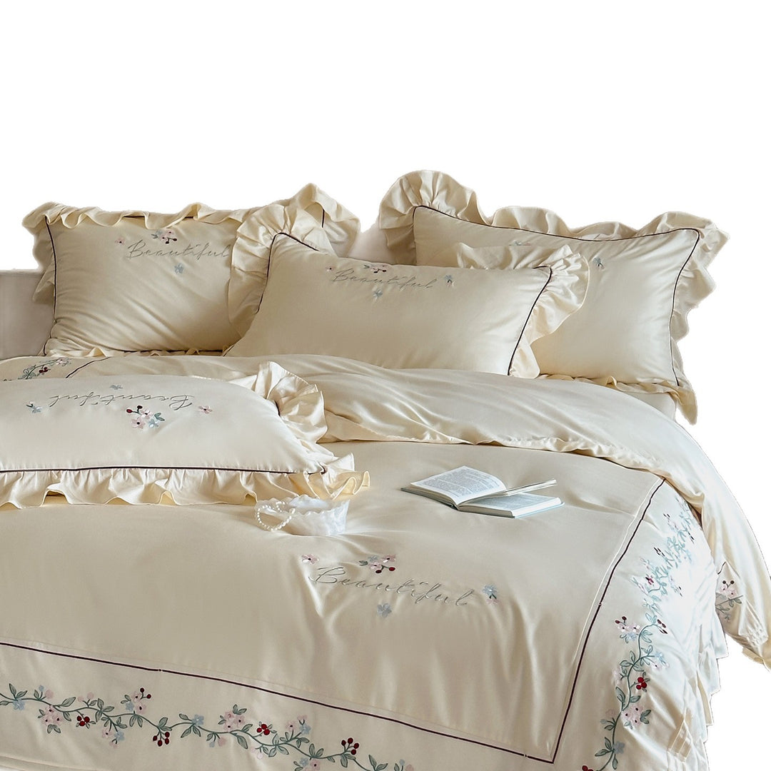 Luxurious bedding set with ruffled hem and floral embroidery