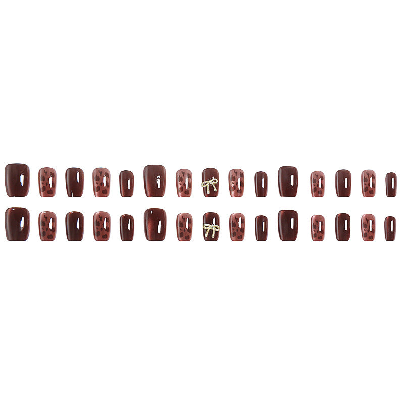 Nail set with elegant leopard pattern and luxurious accents Stornfield