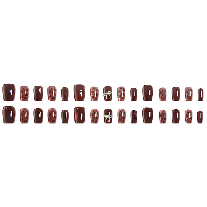 Nail set with elegant leopard pattern and luxurious accents Stornfield