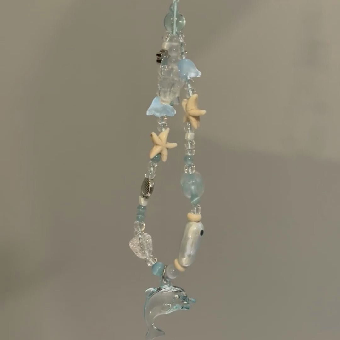 Dolphin-Themed Beaded Charm Eyewear Holder Stornfield