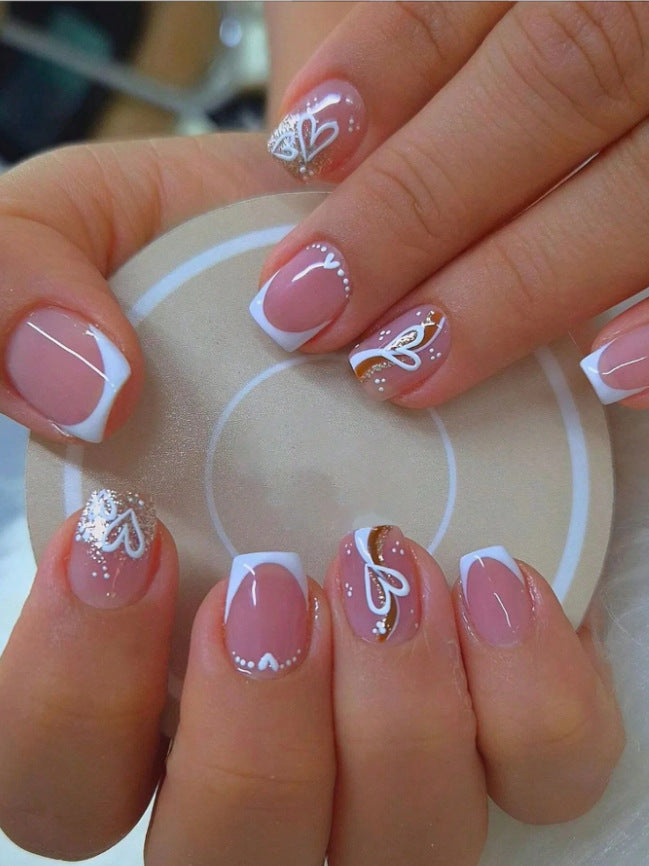 Elegant Heart-Embellished Nail Art Design Stornfield