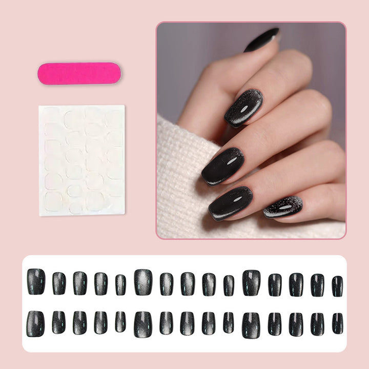 Artificial nail set with glamorous black glitter accents Stornfield
