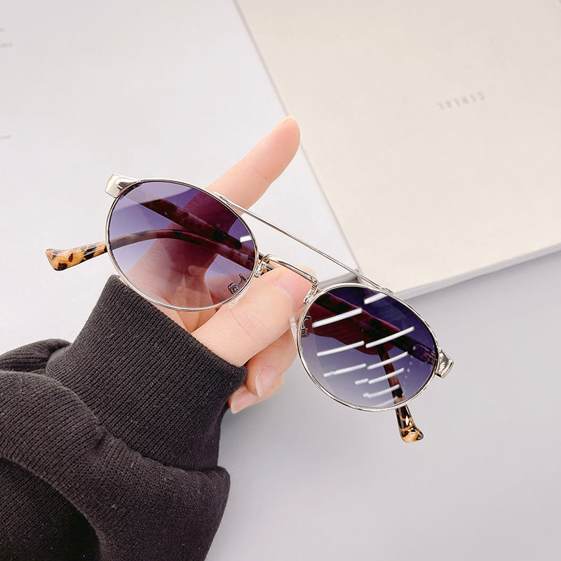 Ladies fashionable sunglasses in stylish round design with golden accents Stornfield