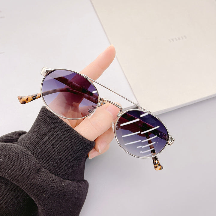 Ladies fashionable sunglasses in stylish round design with golden accents Stornfield