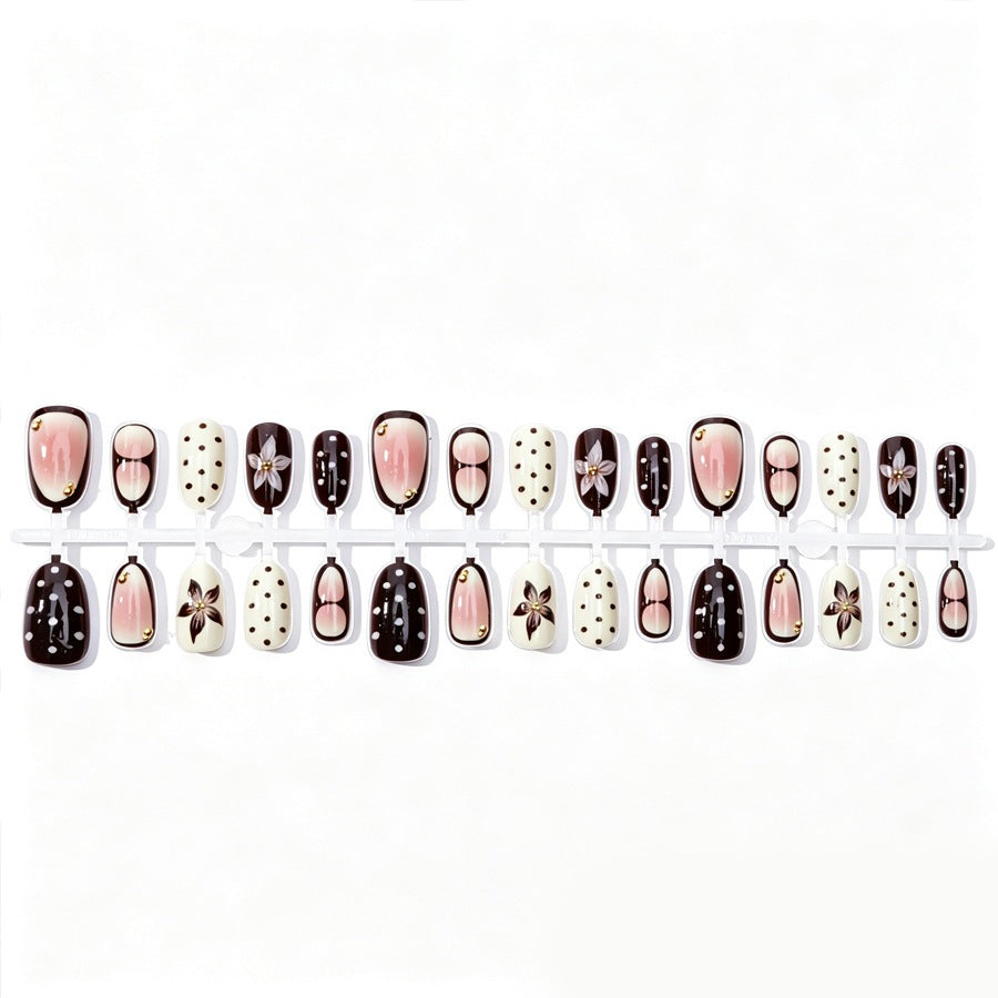 Acrylic nail set with floral accents and elegant design Stornfield