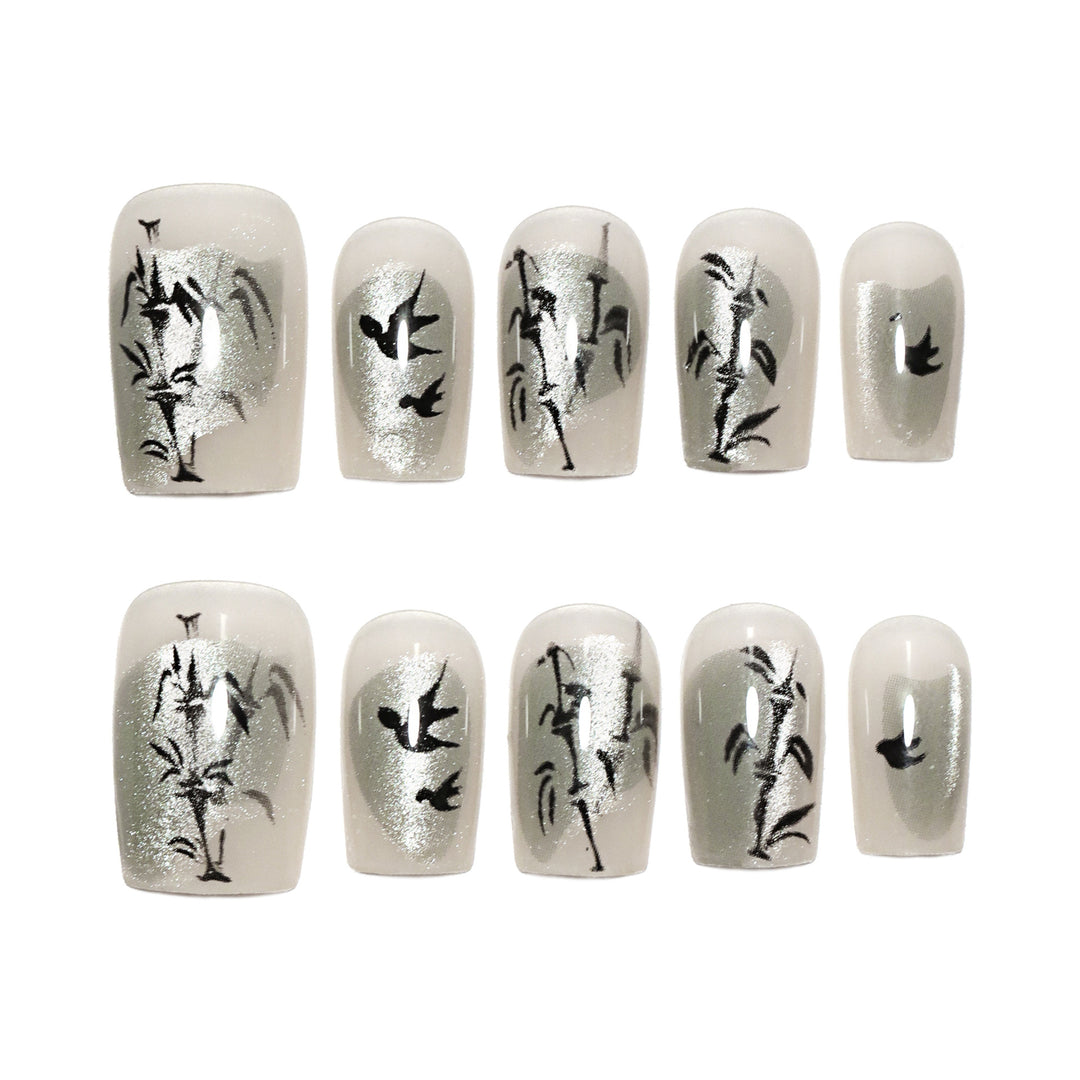 Handcrafted acrylic nails with decorative bird motifs Stornfield
