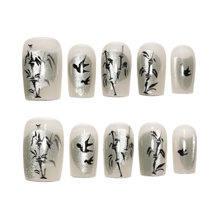 Handcrafted acrylic nails with decorative bird motifs Stornfield